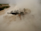 Buy US Marines Return Fire on Taliban Positions Near the Town of Garmser in Afghanistan at AllPosters.com