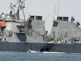 Buy Experts in a Speed Boat Examine the Hull of the USS Cole at the Yemeni Port of Aden at AllPosters.com