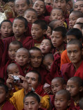 Buddhist Monks Watch a Show During a Public Meeting Addressed by the Dalai Lama