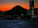 Yokohama City is Lit Up under Dusk at Sunset with the Backdrop of the Mount Fuji