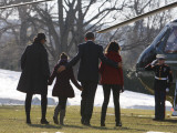 President Barack Obama anf Family Walk on the South Lawn of the White House in Washington