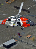 Coast Guard Rescues One from Roof Top of Home, Floodwaters from Hurricane Katrina Cover the Streets