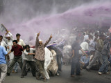 Buy Kashmiri Transporters Shout Amidst Tear Gas Smoke and Colored Water at a Protest in Srinagar, India at AllPosters.com