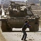 Palestinian Stone Thrower Faces an Israeli Tank, Between Israel and the Gaza Strip