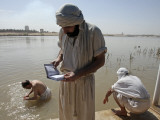 Members of Sabean Mandaeans Practice their Rituals on Banks of Tigris River in Baghdad, Iraq