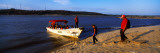 Tourists with a Boat at the Riverside, Orinoco, Ciudad Bolivar, Bolivar State, Venezuela