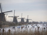 Buy People Skate on Frozen Canals in Kinderdijk's Mill Area, a UNESCO World Heritage Site, Netherlands at AllPosters.com