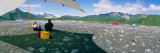 Tourists Sitting at Campsite Near Lake, Bear Glacier Lake, Kenai Fjords National Park, Alaska, USA