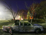Buy Truck Remnants in Front of a House Still Smoldering from a Grass Fire in a Small Town in Texas at AllPosters.com