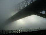 Sydney Harbor Bridge is Covered by a Thick Vail of Fog in the Early Hours of the Morning