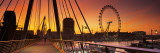 Golden Jubilee Bridge across a Thames River, Ferris Wheel in Back, London, England