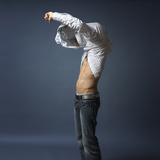 Buy Young Atheletic Filipino Man Putting on a Shirt at AllPosters.com