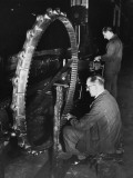 Workers Working on a Gun Turntable in a Munitions Factory During World War Ii