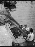 Fishermen Mending their Nets at Brixham, Devon, England