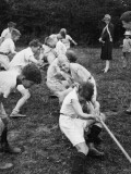 One Half of a Tug of War with Members of a Boys Club. their Supporters Shout Encouragement Photographic Print