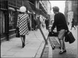 A Lady Walks under a Ladder- She Obviously Does Not Believe it Is Unlucky