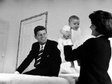 Buy Senator Jack Kennedy Watching with Delight as His Wife Jackie Holds Up their Daughter Caroline at AllPosters.com