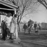 Carrying Home Freshly Shot Rabbits and a Cedar Tree for Christmas Family Reunion