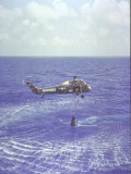 Buy Project Mercury Freedom 7 Capsule and Astronaut Alan Shepard Are Lifted Out of Ocean by Helicopter at AllPosters.com