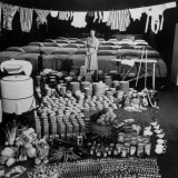 Housewife Marjorie McWeeney Amidst Symbolic Display of Her Week's Housework at Bloomingdale's