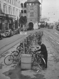 Using Bicycles as a Means of Transport; Sidewalks Have Special Slots for Wheels at Parking Spots