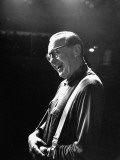 Comedian Jack Benny Laughing as He Stands Alone under TV Lights at Studio During Rehearsal