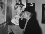 Unidentified Woman Looking at Painting by Artist Salvador Dali