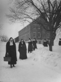 Date Unknownnuns Walking Through Snow to Help with Construction of Priory