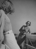 Photographer Nina Leen Speaking to Fashion Model, Who Is Posing in Fore