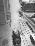 Buy The R.R. Station Using One its Locomotives to Heat it's Office Buildings at AllPosters.com