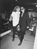 Actress Kathleen Turner Giving First-Time Bowler Bianca Jagger Pointers