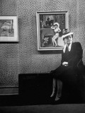 Buy Lady Sitting in Front of Painting Created by James Montgomery Flagg at AllPosters.com