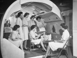Buy Students at the McConnell Air Hostess School Learning How to Change a Baby at AllPosters.com