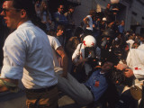 Red Cross Helping Distressed Protestor During Anti-War Demonstration