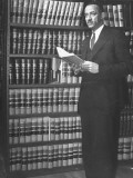 Dean of Howard University Law School William H. Hastie Standing by Bookshelves