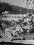 Leroy Loeffler, Who Earns $3000 a Year, Relaxing on Lounge Chair in His Yard with Family