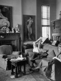 Buy James Montgomery Flagg Relaxing in His Studio and Talking with a Model at AllPosters.com