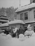 Buy Men Shoveling Snow Outside Restaurant at AllPosters.com