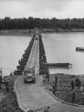 Soldiers Driving across Pontoon Bridge