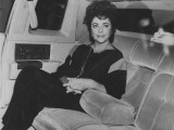 Actress Elizabeth Taylor Sitting in the Back of a Limo