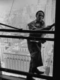 A Window Washer Cleaning the Windows