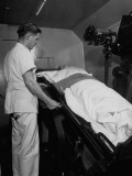 Buy Doctor Adjusting Patient's Position before Taking X-Ray at AllPosters.com