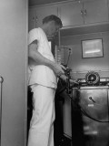 Buy Doctor Operating X-Ray in Compartment at Rear of Trailer at AllPosters.com
