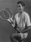 Tennis Pro Bobby Riggs Posing with Two Tennis Racquets