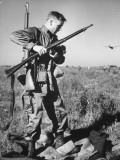 A Paratrooper Regrouping after Landing