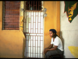 Musician Ziggy Marley Posing by Barred Doorway