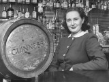 Buy Irish Barmaid at Airport Bar with Keg of Guinness Beer at AllPosters.com