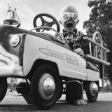 Young Boy Playing with Toy Fire Truck