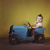 Baby Girl Sitting Inside Toy Car