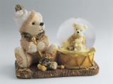 Close-Up of a Teddy Bear with a Snow Globe